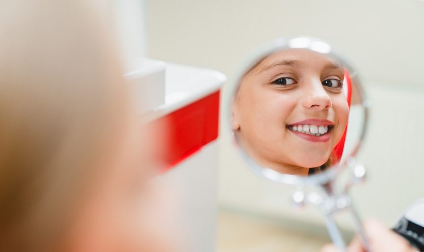 girl looking at the mirror
